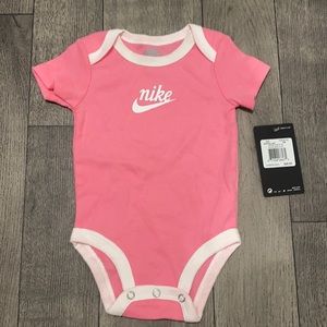 Pink Nike onesie